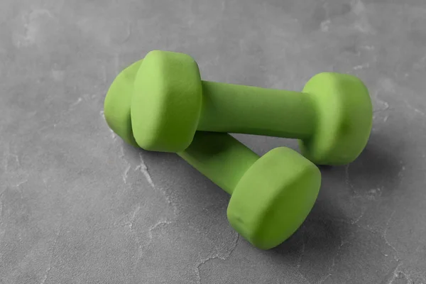 Adjustable dumbbells are a compact and versatile option