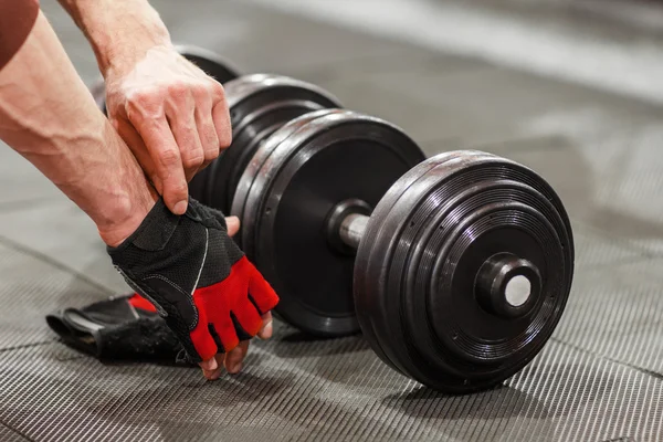 Workout gloves provide comfort and grip for lifting weights